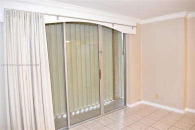 Spacious 2/2 on ground floor with views to the well maintained on Woodmont Country Club in Florida - for sale on GolfHomes.com, golf home, golf lot