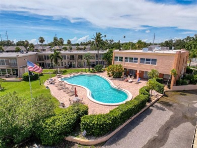Discover this charming two-bedroom, two-bathroom condo in the on East Bay Golf Club in Florida - for sale on GolfHomes.com, golf home, golf lot