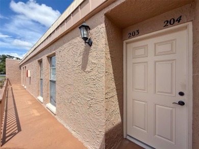 Discover this charming two-bedroom, two-bathroom condo in the on East Bay Golf Club in Florida - for sale on GolfHomes.com, golf home, golf lot