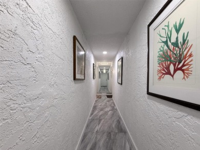 Discover this charming two-bedroom, two-bathroom condo in the on East Bay Golf Club in Florida - for sale on GolfHomes.com, golf home, golf lot