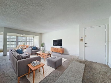 Discover this charming two-bedroom, two-bathroom condo in the on East Bay Golf Club in Florida - for sale on GolfHomes.com, golf home, golf lot