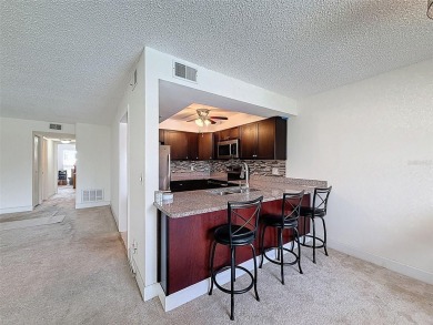 Discover this charming two-bedroom, two-bathroom condo in the on East Bay Golf Club in Florida - for sale on GolfHomes.com, golf home, golf lot