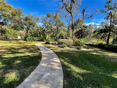 Absolutely stunning 4 bedroom, 2 bath executive home on almost 2 on Walden Lake Golf and Country Club  in Florida - for sale on GolfHomes.com, golf home, golf lot