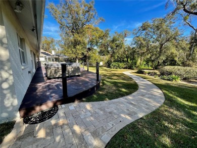 Absolutely stunning 4 bedroom, 2 bath executive home on almost 2 on Walden Lake Golf and Country Club  in Florida - for sale on GolfHomes.com, golf home, golf lot