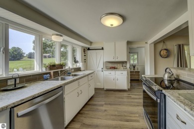 Step into the charm of Northern Michigan and a Slice of Bellaire on Shanty Creek Golf Course in Michigan - for sale on GolfHomes.com, golf home, golf lot