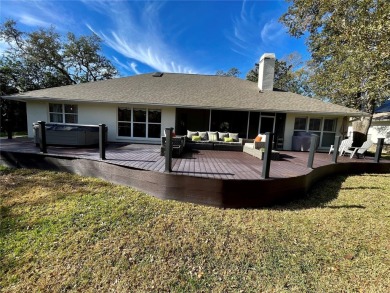 Absolutely stunning 4 bedroom, 2 bath executive home on almost 2 on Walden Lake Golf and Country Club  in Florida - for sale on GolfHomes.com, golf home, golf lot