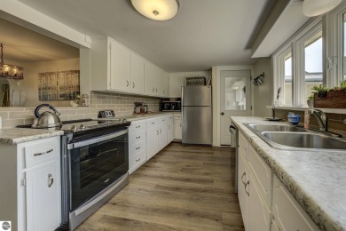 Step into the charm of Northern Michigan and a Slice of Bellaire on Shanty Creek Golf Course in Michigan - for sale on GolfHomes.com, golf home, golf lot