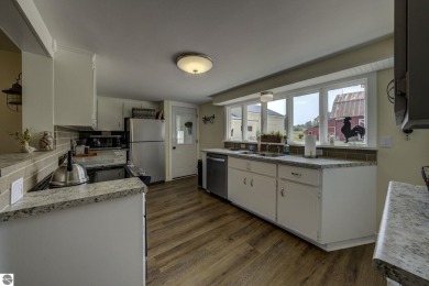 Step into the charm of Northern Michigan and a Slice of Bellaire on Shanty Creek Golf Course in Michigan - for sale on GolfHomes.com, golf home, golf lot