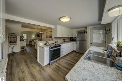 Step into the charm of Northern Michigan and a Slice of Bellaire on Shanty Creek Golf Course in Michigan - for sale on GolfHomes.com, golf home, golf lot