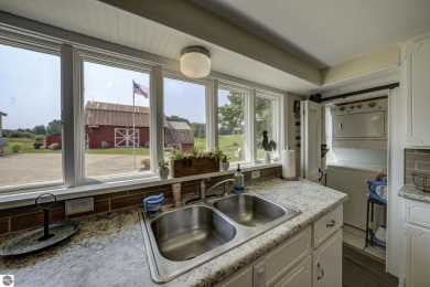 Step into the charm of Northern Michigan and a Slice of Bellaire on Shanty Creek Golf Course in Michigan - for sale on GolfHomes.com, golf home, golf lot