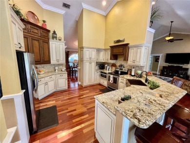 Absolutely stunning 4 bedroom, 2 bath executive home on almost 2 on Walden Lake Golf and Country Club  in Florida - for sale on GolfHomes.com, golf home, golf lot