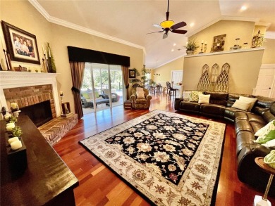 Absolutely stunning 4 bedroom, 2 bath executive home on almost 2 on Walden Lake Golf and Country Club  in Florida - for sale on GolfHomes.com, golf home, golf lot