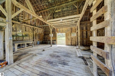 Step into the charm of Northern Michigan and a Slice of Bellaire on Shanty Creek Golf Course in Michigan - for sale on GolfHomes.com, golf home, golf lot