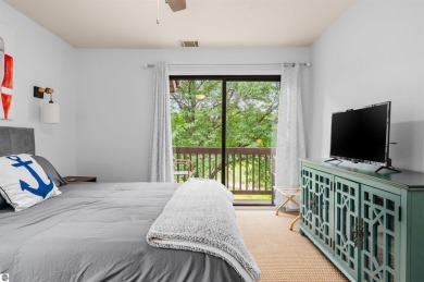 Perched above the third tee of Spruce Run Golf Course, this on Grand Traverse Resort and Spa in Michigan - for sale on GolfHomes.com, golf home, golf lot