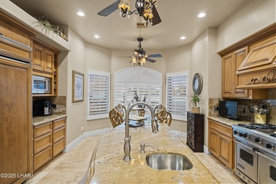 Welcome to 2325 Demaret Drive, an iconic and timeless estate on London Bridge Golf Course in Arizona - for sale on GolfHomes.com, golf home, golf lot