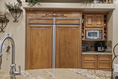 Welcome to 2325 Demaret Drive, an iconic and timeless estate on London Bridge Golf Course in Arizona - for sale on GolfHomes.com, golf home, golf lot