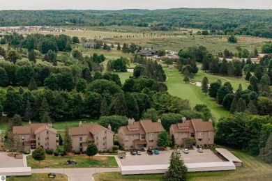 Perched above the third tee of Spruce Run Golf Course, this on Grand Traverse Resort and Spa in Michigan - for sale on GolfHomes.com, golf home, golf lot