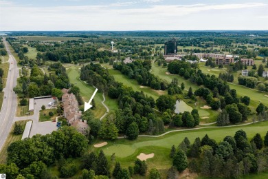 Perched above the third tee of Spruce Run Golf Course, this on Grand Traverse Resort and Spa in Michigan - for sale on GolfHomes.com, golf home, golf lot