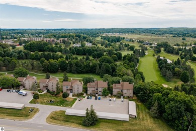 Perched above the third tee of Spruce Run Golf Course, this on Grand Traverse Resort and Spa in Michigan - for sale on GolfHomes.com, golf home, golf lot