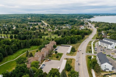 Perched above the third tee of Spruce Run Golf Course, this on Grand Traverse Resort and Spa in Michigan - for sale on GolfHomes.com, golf home, golf lot
