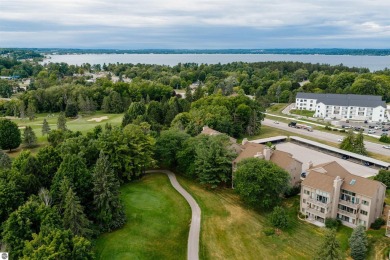 Perched above the third tee of Spruce Run Golf Course, this on Grand Traverse Resort and Spa in Michigan - for sale on GolfHomes.com, golf home, golf lot