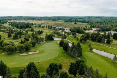 Perched above the third tee of Spruce Run Golf Course, this on Grand Traverse Resort and Spa in Michigan - for sale on GolfHomes.com, golf home, golf lot