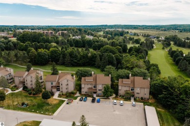 Perched above the third tee of Spruce Run Golf Course, this on Grand Traverse Resort and Spa in Michigan - for sale on GolfHomes.com, golf home, golf lot