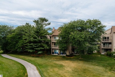 Perched above the third tee of Spruce Run Golf Course, this on Grand Traverse Resort and Spa in Michigan - for sale on GolfHomes.com, golf home, golf lot