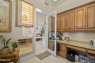 Welcome to 2325 Demaret Drive, an iconic and timeless estate on London Bridge Golf Course in Arizona - for sale on GolfHomes.com, golf home, golf lot