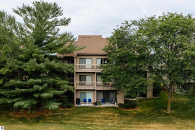 Perched above the third tee of Spruce Run Golf Course, this on Grand Traverse Resort and Spa in Michigan - for sale on GolfHomes.com, golf home, golf lot