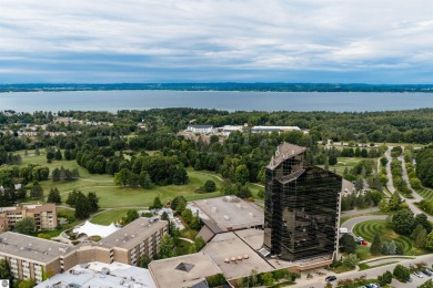 Perched above the third tee of Spruce Run Golf Course, this on Grand Traverse Resort and Spa in Michigan - for sale on GolfHomes.com, golf home, golf lot
