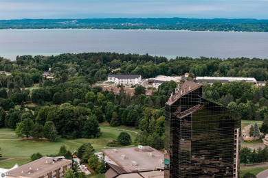 Perched above the third tee of Spruce Run Golf Course, this on Grand Traverse Resort and Spa in Michigan - for sale on GolfHomes.com, golf home, golf lot