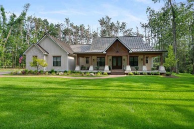 Welcome to your dream home in the heart of Boyne Highlands! on Boyne Highlands Golf Courses in Michigan - for sale on GolfHomes.com, golf home, golf lot