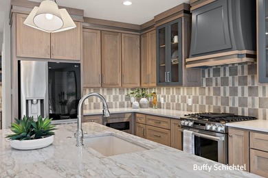 Experience refined living in this stunning golf course property on Muskegon Country Club in Michigan - for sale on GolfHomes.com, golf home, golf lot