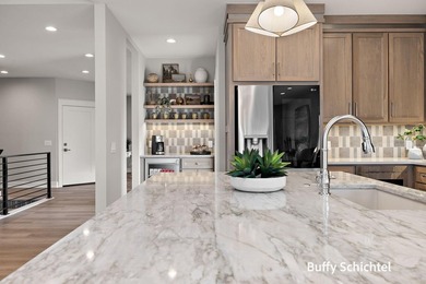 Experience refined living in this stunning golf course property on Muskegon Country Club in Michigan - for sale on GolfHomes.com, golf home, golf lot