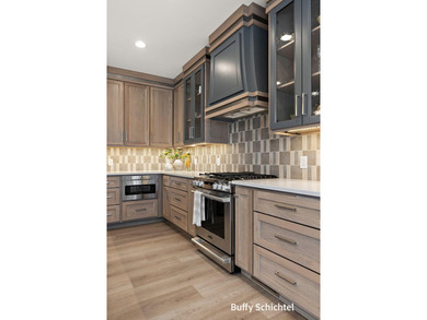 Experience refined living in this stunning golf course property on Muskegon Country Club in Michigan - for sale on GolfHomes.com, golf home, golf lot