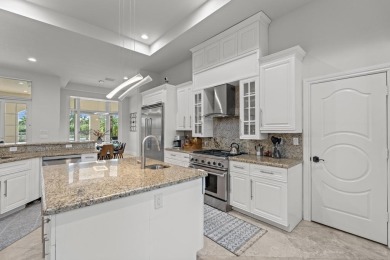 Experience unparalleled luxury in this 6,823-sq-ft under air on The Wanderers Club in Florida - for sale on GolfHomes.com, golf home, golf lot