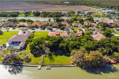 Welcome to your Mediterranean-Spanish waterfront home! This on Rancho Viejo Resort and Country Club in Texas - for sale on GolfHomes.com, golf home, golf lot