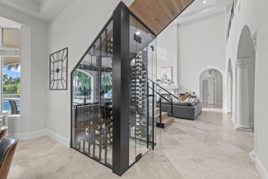 Experience unparalleled luxury in this 6,823-sq-ft under air on The Wanderers Club in Florida - for sale on GolfHomes.com, golf home, golf lot