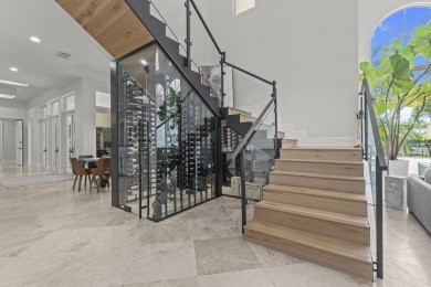 Experience unparalleled luxury in this 6,823-sq-ft under air on The Wanderers Club in Florida - for sale on GolfHomes.com, golf home, golf lot