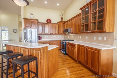 Experience elevated lakefront living at Lake of the Ozarks! One on Seasons Ridge At Four Seasons in Missouri - for sale on GolfHomes.com, golf home, golf lot