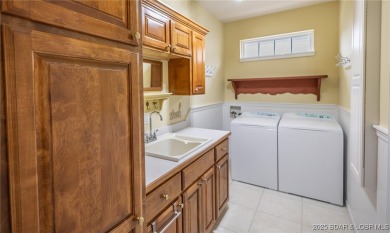 Experience elevated lakefront living at Lake of the Ozarks! One on Seasons Ridge At Four Seasons in Missouri - for sale on GolfHomes.com, golf home, golf lot