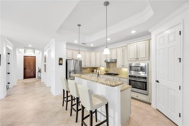 Welcome to elegant coastal living in sought after Fiddler's on The Golf Club At Fiddlers Creek in Florida - for sale on GolfHomes.com, golf home, golf lot