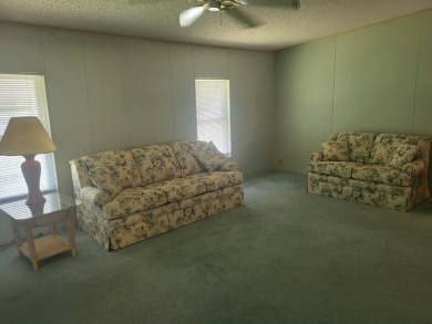 2/2 home has open floor plan. Large eat-in kitchen has lots of on Lake Henry Golf Club in Florida - for sale on GolfHomes.com, golf home, golf lot