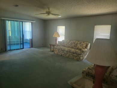 2/2 home has open floor plan. Large eat-in kitchen has lots of on Lake Henry Golf Club in Florida - for sale on GolfHomes.com, golf home, golf lot