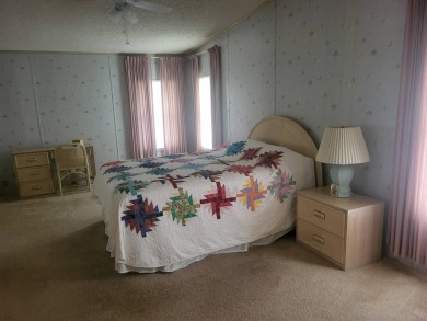 2/2 home has open floor plan. Large eat-in kitchen has lots of on Lake Henry Golf Club in Florida - for sale on GolfHomes.com, golf home, golf lot