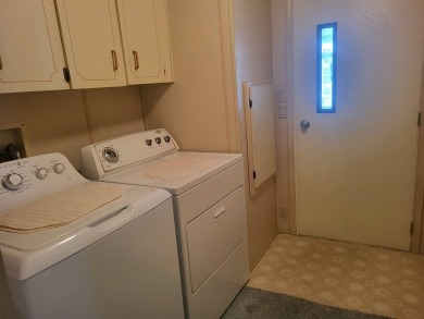 2/2 home has open floor plan. Large eat-in kitchen has lots of on Lake Henry Golf Club in Florida - for sale on GolfHomes.com, golf home, golf lot