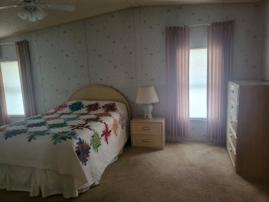 2/2 home has open floor plan. Large eat-in kitchen has lots of on Lake Henry Golf Club in Florida - for sale on GolfHomes.com, golf home, golf lot