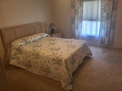 2/2 home has open floor plan. Large eat-in kitchen has lots of on Lake Henry Golf Club in Florida - for sale on GolfHomes.com, golf home, golf lot