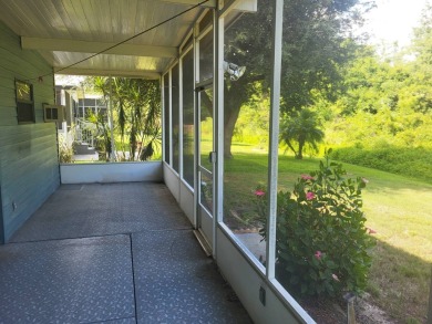 2/2 home has open floor plan. Large eat-in kitchen has lots of on Lake Henry Golf Club in Florida - for sale on GolfHomes.com, golf home, golf lot
